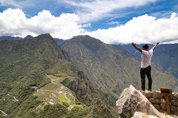 Traveller at the Lost city of the Incas, Machu Picchu,Peru on top of the mountain, with the view panoramic