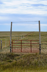 Gated fence to enclose horses in Colorado, USA.