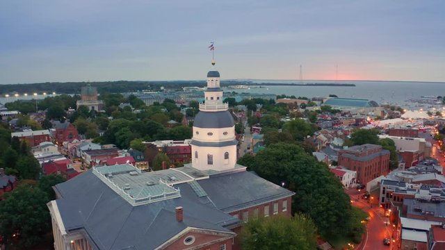 Aerial drone footage of Annapolis at dawn. Annapolis is the capital of the US state of Maryland and the county seat of Anne Arundel County. The drone rotates around the Maryland state house.