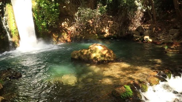 Waterfall Banias. Water stream. Spring of river Hermon. Nature Reserve and National park - a popular place for tourist trips with locals and foreign tourists in the north of Israel
