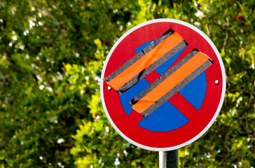 Traffic sign suspended with adhesive tape
