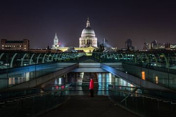 Millennium Bridge and St Pauls Cathedral at night in London