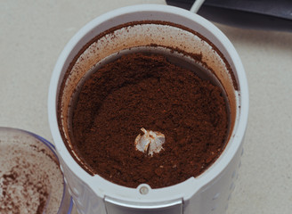 Ground coffee in a coffee grinder