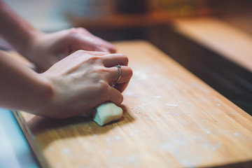 Woman prepare dumpling skin, Making dough  on wooden table