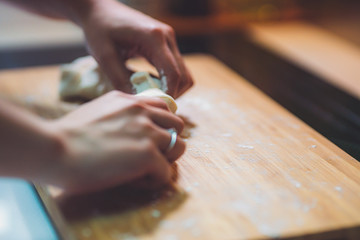 Woman prepare dumpling skin, Making dough  on wooden table