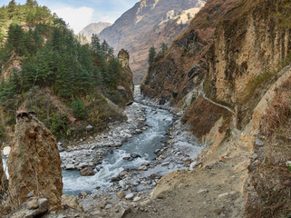 Annapurna Circuit Track- view of the river and Kali Gandaki canyon, on the background Tukuche Peak, near the village of Ghasa. Nepal, the Himalayas.