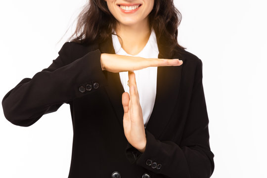 Businesswoman make symbol of time out or break time for stopping working with smiley face. Business woman wants to taking a rest. Working woman working all day and she want to take a rest for while