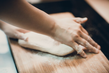 Woman prepare dumpling skin, Making dough  on wooden table