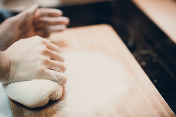 Woman prepare dumpling skin, Making dough  on wooden table