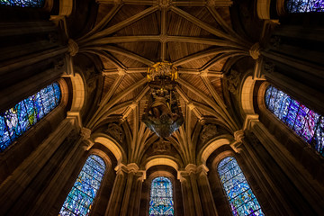 Fototapeta premium EDINBURGH, SCOTLAND, DECEMBER 15, 2018: Bottom view of the dome of the Scottish National War Memorial, with an oak carving of St. Michael surrounded by beautifil stained glasses.