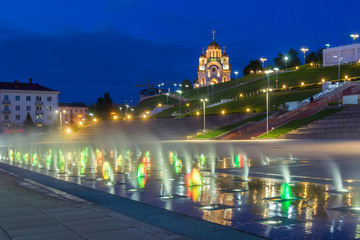 Glowing fountain on the Glory Square in Samara at evening