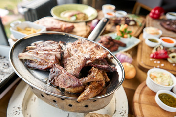 Barbecue restaurant menu. Many different food on the table. Dinner party or Banquet.