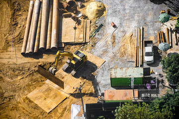 Aerial view of site preparation, site clearance, ground works and foundation stage.