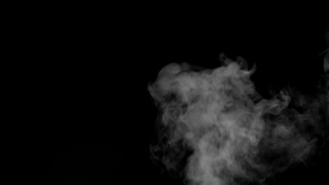 White smoke floating on isolated black background,water spray steam slow motion, Spooky element for halloween day