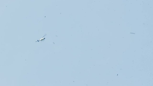 Police Helicopter Hovering Over A Ticker Tape Parade In New York City