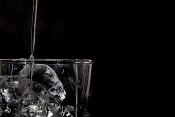 pouring water into glass