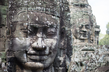 gargantuan smiling faces of Avalokiteshvara in Bayon temple, Siem Reap, Cambodia