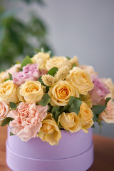 Floral shop concept . Flower arrangement in a round box. Beautiful bouquet of mixed flowers. Handsome fresh bunch. Flowers delivery