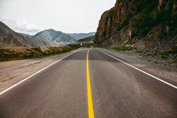 high-speed road between the mountains in Altai