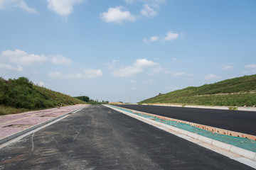Unfinished city asphalt road landscape