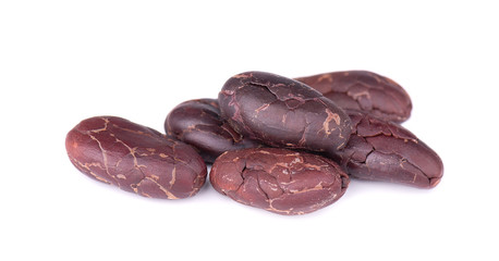 Peeled cacao beans, isolated on white background. Roasted and aromatic cocoa beans, natural chocolate.