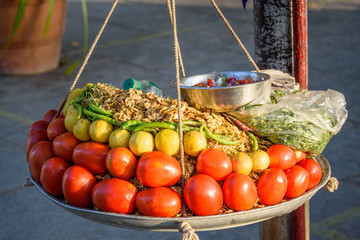 Indian street spicy snack Chana Jor Garam or Chana Chor Garam on the street market. Udaipur. India