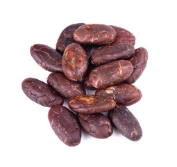 Peeled cacao beans, isolated on white background. Roasted and aromatic cocoa beans, natural chocolate. Top view.
