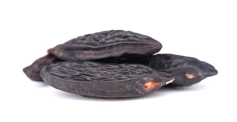 Tonka beans isolated on white background. Bean of Dipteryx odorata, cumaru or kumaru. Fresh aroma tonka beans.