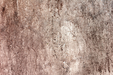 Texture of a concrete wall with cracks and scratches which can be used as a background
