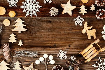 Frame Of Christmas Decoration Like Star, Sled, Tree, Fir Cone And Snowflakes. Brown Wooden Background With Copy Space