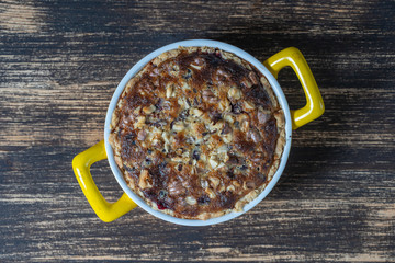Homemade organic currant pie with walnut, dessert ready to eat. Currant tart on the old wooden background, closeup