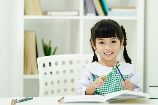 Happy student kid girl enjoy learning at school.  Education concept  
