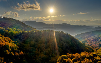 aerial view photo of sunset in pisgah national forest at the Appalachian Mountains at the beginning of fall foliage - obrazy, fototapety, plakaty