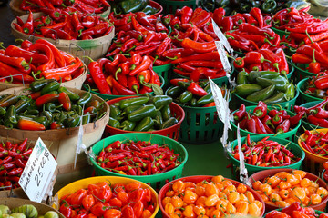 Biologic, natural cultivated hot pepper on a market counter.