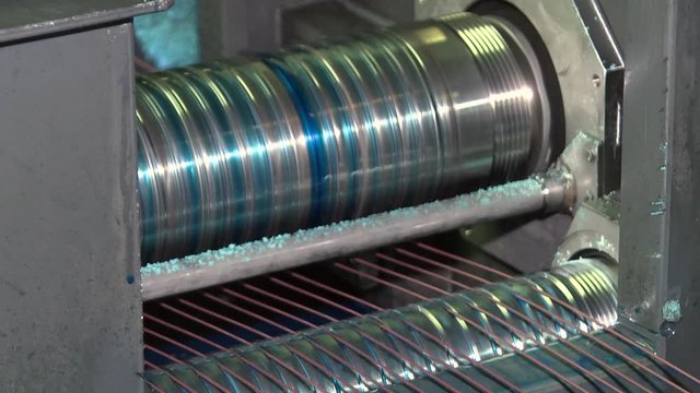 Production of wire by drawing technology. Wire production line by drawing method. Direct-flow drawing mill with program control. A container with a blue liquid for copper-plating wire.