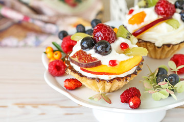 Colorful cupcakes with fresh fruits.