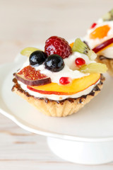 Colorful cupcakes with fresh fruits.
