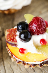 Colorful cupcakes with fresh fruits.