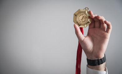 Businessman with gold medal. Medal awards for winner