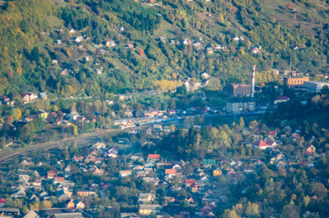 A small town among the mountains in autumn, top view
