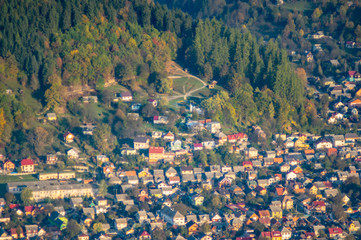 A small town among the mountains in autumn, top view