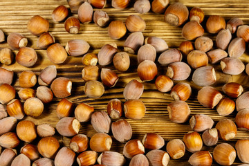 Heap of hazelnuts on a wooden table
