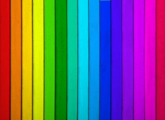 Texture of rainbow wooden surface as background, top view