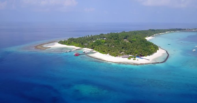 Tropical island surrounded by beautiful lagoons. The Philippines. Rest on a tropical island. aerial drone establishing shot,