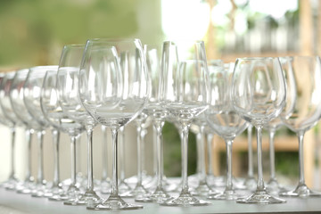 Empty glasses on table against blurred background
