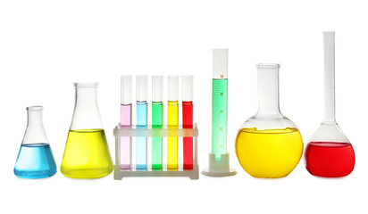 Laboratory glassware with colorful liquids on white background
