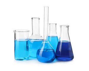 Laboratory glassware with blue liquids isolated on white