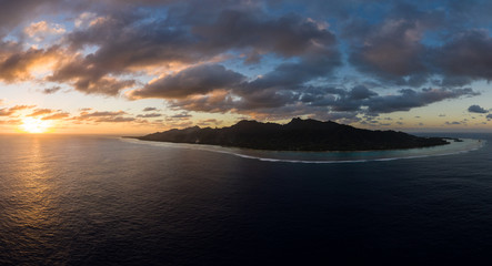 Aerial panorama of the entire Rarotonga island during a dramatic sunset in the Cooks island archipelago in the south Pacific.