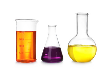 Laboratory glassware with color liquids on white background