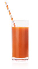Carrot juice in a glass with a striped straw